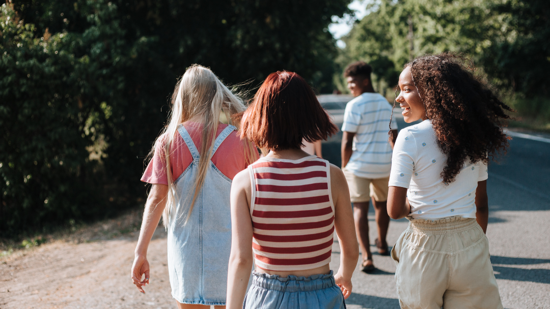 A group of teenagers walking together outdoors